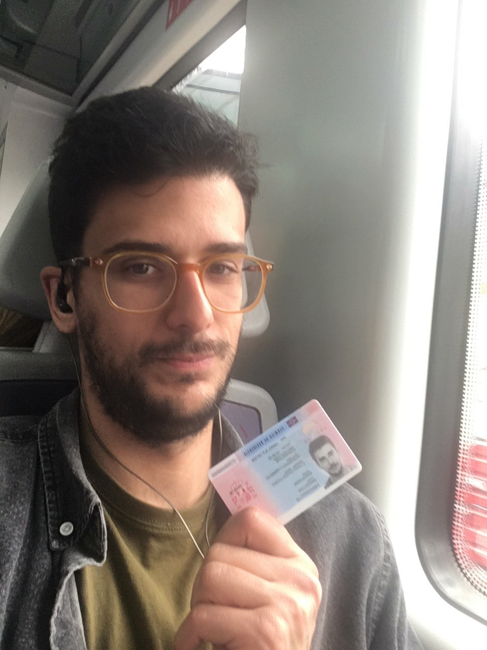 A relieved Alp holding his the long-awaited card.